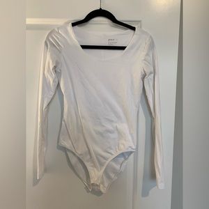 Pact white long sleeve bodysuit